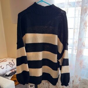 Elegant Black and Cream Striped Women's Turtleneck Sweater